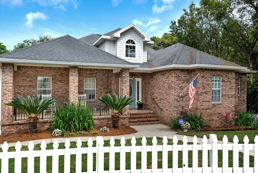 'The Pottery Barn House'' situated on a large over-sized lot in the desirable community of Lake Lorraine Gardens in Shalimar! From top to the bottom and everything in between this home has been upgraded. The Southern style covered, front porch welcomes you thru the white picket fence. The foyer greets to a desirable open floor plan with Gourmet kitchen equipped: custom cabinets, large pantry, center island, breakfast bar, granite counter tops and a built-in desk. Stainless steel appliances including French door refrigerator with water and ice in door, gas cooktop and double oven. Spilling into the family room perfect for entertaining, wired for surround sound, crown molding, fantastic gas fireplace with custom mantle. Perfect back deck (recently refinished) perfect for overlooking the