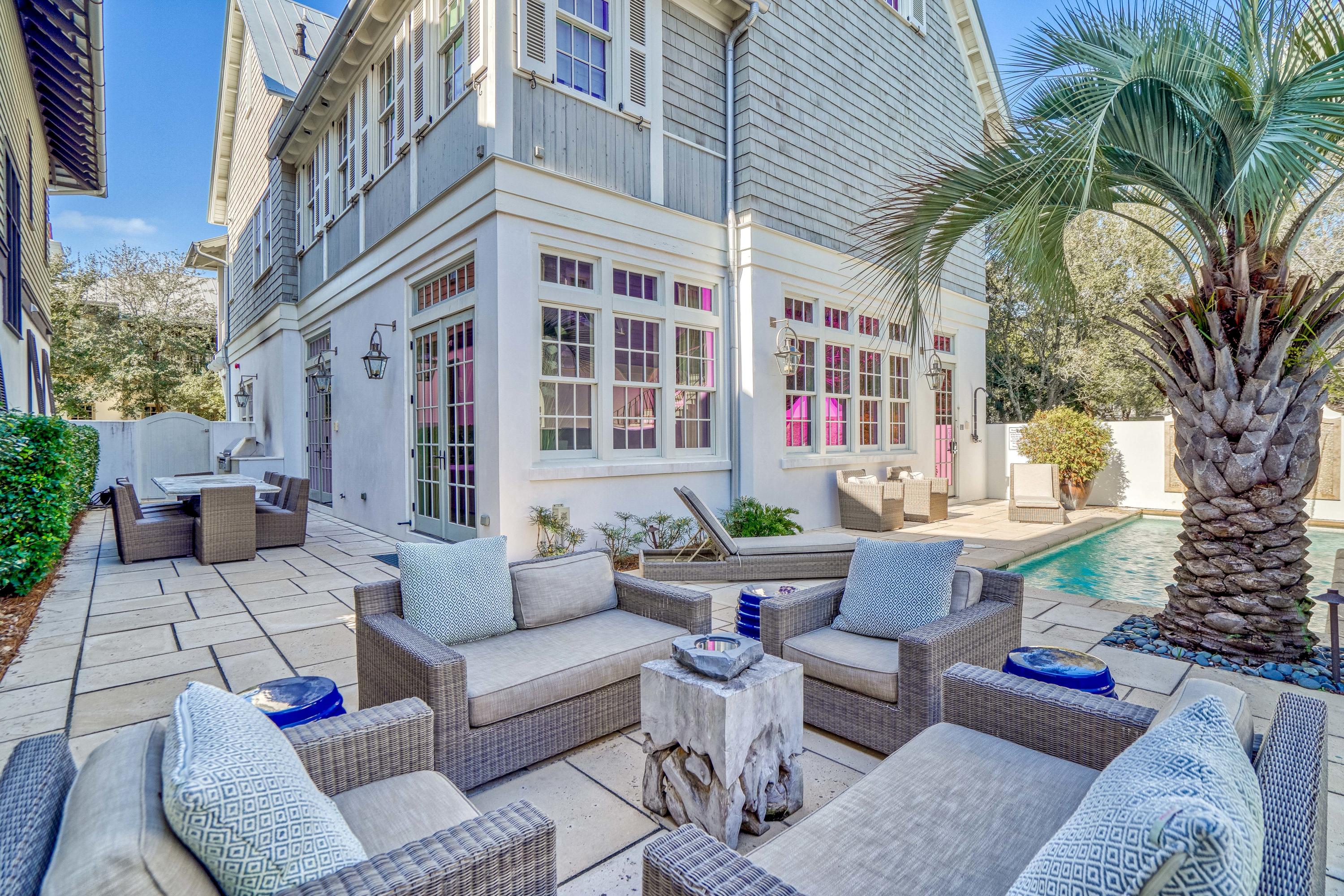 STEPS TO THE BEACH, 'Serendipity' is THE Premier Vacation Home in Rosemary Beach, FL. Rental income surpassed $436K in 2021 and has $218K booked in 2022 (so far)! Located South of 30A & just a short stroll to the shimmering turquoise waters of the Gulf of Mexico; relax in luxury resort style w/ a PRIVATE COURTYARD, HEATED  POOL, fireplace & outdoor dining for 10. Truly an OASIS FOR FAMILY LIVING! This elegant home has a MASTER SUITE ON THE 1st floor, another LAVISH MASTER SUITE on 2nd floor, & 2 guest suites. The 3rd floor has a bunk room, game room, & theater! A spacious carriage house apartment over 2 car garage provides additional sleeping quarters. STUNNING interiors have new living room furnishings, venetian plaster walls, reclaimed wood beams, and marble/limestone kitchen & baths.