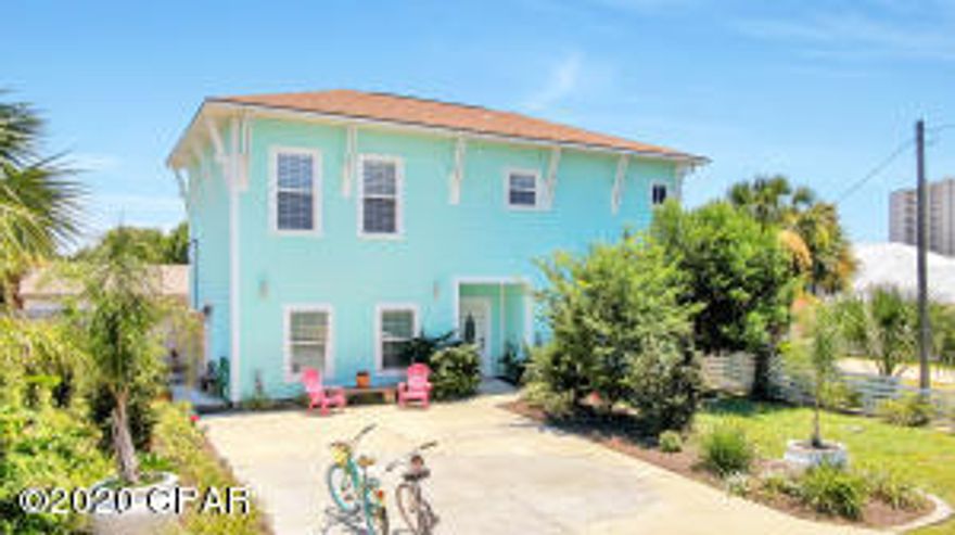 I love this Key West Style home! This home is only 600 feet away from the beach, loaded with charm (custom built by an artist), has separate living quarters and has an abundance of outdoor entertaining space. The main home has an airy & open living/dining and kitchen area, cathedral ceilings, tile flooring, plenty of windows and charm galore! The living area has three sets of French doors leading to the large, private patio. The second floor has a very quaint and unique loft master suite along with nice size guest bedrooms. One of my favorite features of this home is the separate living quarters. This area is attached to the main home at the ground level. It can be used as a lock out; mother in law suite, art studio.