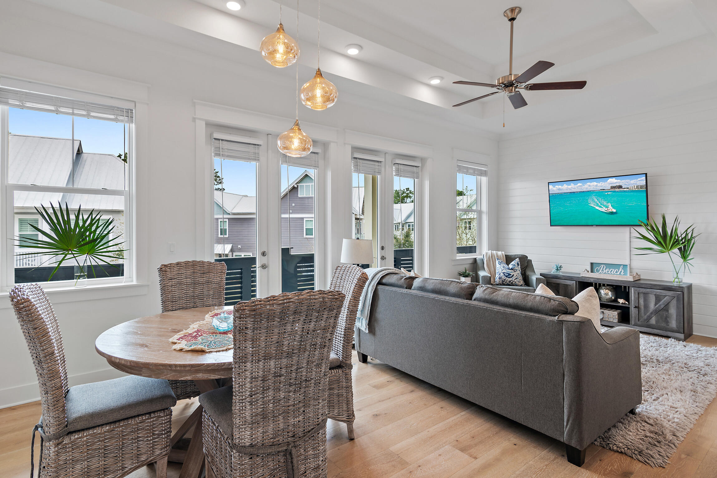 Prominently positioned in the resort-style community of Prominence on 30A, ''Shell Yeah'' seamlessly blends luxury accommodations with inviting coastal charm. Upstairs, the heart of the home welcomes you into a sophisticated living space thoughtfully designed for both relaxation and entertainment. Abundant natural light and warm wood tones create a serene coastal ambiance. The gourmet kitchen showcases stunning Crystal Ice quartz countertops, a premium stainless-steel appliance package with a gas cooktop, and an extended island with integrated seating. The spacious primary suite, bathed in natural light, features a custom tray ceiling and picturesque views of the lush green space. Its spa-like ensuite boasts a double vanity, a walk-in closet, and a beautifully tiled walk-in wet room. An additional guest room currently configured as a bunk room with a trundle along with a full bath and laundry, complete the second level.
Nestled in the sought-after community of Prominence, homeowners and guests enjoy access to two resort-style pools, community grills, walking trails, open green spaces, and The Big Chill, home to some of the area's top dining and entertainment venues. This fully furnished unit boasts numerous updates and premium upgrades, including Integrated UV air filtration in the HVAC system, accent walls, shiplap surfaces, and a newly epoxied and sealed garage floor, among many other enhancements. With impressive rental potential annual revenue projections exceeding $40,000 and its turnkey, fully furnished configuration, 146 Pine Lands Loop #C presents an outstanding opportunity for investors and those seeking a second home or full-time residence.
Schedule a private viewing today and start living the coastal lifestyle you deserve!