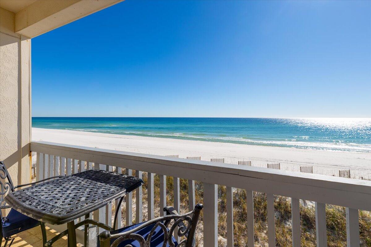 Stunning 2 bd, 2ba, GULF FRONT condo in Villas on the Gulf on Pensacola Beach. This top floor unit built in 2007 features light & bright coastal paint, 9 ft ceilings, luxury vinyl plank flooring, and impact glass sliding doors and windows. Wow your friends and family and guests with spectacular views of the Gulf that can be enjoyed from almost every room. The open kitchen which features beautiful wood cabinets and great counter space. A split bedroom floor plan offers plenty of privacy for both bedrooms. The waterfront primary suite has a private bathroom with a tub/shower combo. The guest bedroom has twin over full bunk beds and is next to the guest bathroom. Lots of memories to be made here. A strong Rental history and low HOA dues make this a perfect investment.