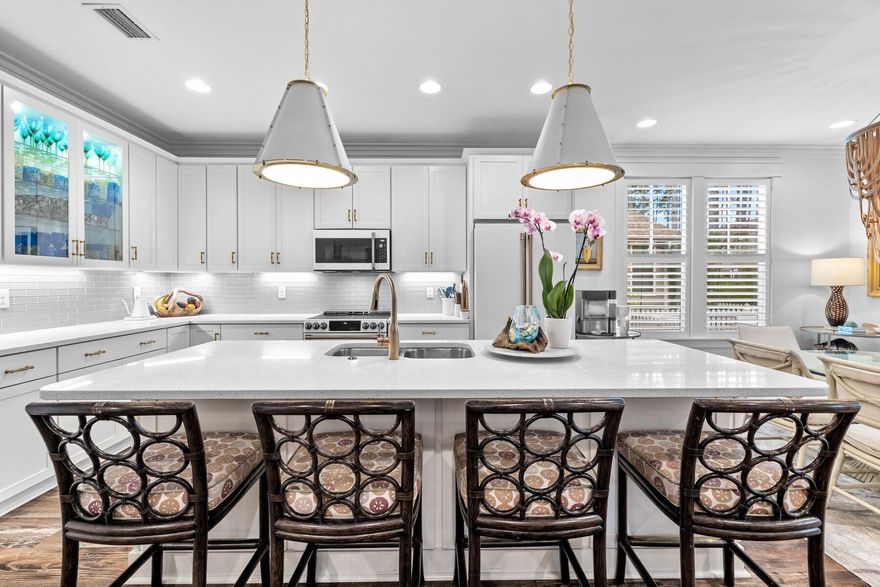 Positioned on a premium corner lot in the coveted Winter Garden phase of Watersound Origins, this beautifully appointed Huff-built home offers refined comfort surrounded by lush, mature landscaping. Designed for effortless single-level living, the 2,616-square-foot layout features four bedrooms, three and a half bathrooms, and a dedicated office or flex space.Inside, the heart of the home centers around a thoughtfully designed kitchen featuring quartz countertops, custom cabinetry, and a new GE Cafe Series appliance suite -- complete with induction cooktop, double ovens, wine and beverage fridge, dishwasher, and refrigerator. Updates continue throughout with stylish new lighting in the kitchen, dining area, and foyer. The open-concept design seamlessly flows into the living and dining spaces, while a screened porch equipped with Bromic heaters and fenced backyard provide inviting areas for outdoor relaxation and entertaining. The primary suite includes a custom California Closets upgrade, enhancing both organization and luxury. The home's location, just one block from the clubhouse, also provides easy access to a resort-style pool, playground, and fitness center.

Nature enthusiasts will appreciate the scenic trail located directly behind the home, offering both privacy and convenient access to the community's extensive pathways that connect to Watersound Commons. Residents enjoy an active, vibrant lifestyle with tennis and pickleball courts, a Davis Love-designed executive golf course, and year-round neighborhood gatherings. Nearby, the Monarch Art Trail and a growing array of shops, restaurants, and weekly farmers markets add to the community's appeal.

Set on a .19-acre corner lot within one of the most desirable non-short-term rental communities on the Emerald Coast, this home presents an exceptional opportunity to enjoy the best of Watersound Origins living, where natural beauty and modern convenience meet in perfect harmony.