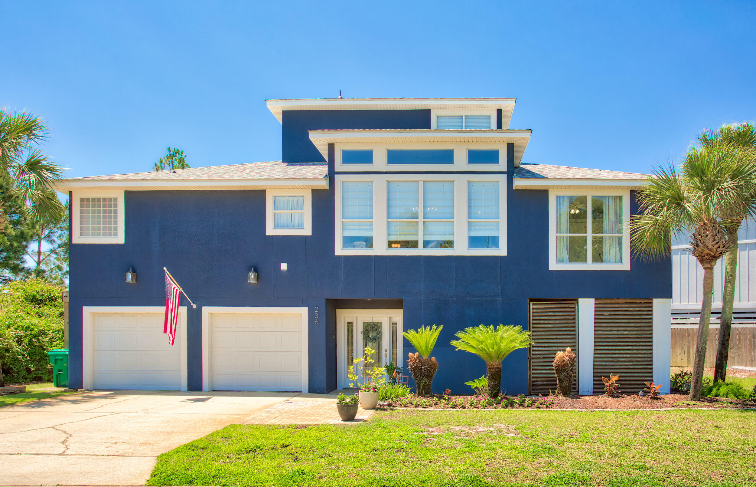 Waterfront elegance in a gated community and minutes from Hurlburt Field, this 5 bedroom, 3 bath home offers 3,322 square feet of coastal living. Located on a 0.38-acre waterfront lot, this residence blends serene views with elegant finishes. Inside, you'll find an open-concept floor plan featuring engineered hardwood flooring, soaring ceilings, and abundant natural light. The kitchen boasts granite countertops, stainless steel appliances, and custom cabinetry. French doors open from the living area and multiple bedrooms onto large private balconies. The home features a bedroom and living space upstairs providing various options for guests, a two-car garage and a large ground-level enclosed area. With close proximity to beaches, shopping, and dining, this is coastal living at its finest.