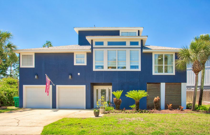 Waterfront elegance in a gated community and minutes from Hurlburt Field, this 5 bedroom, 3 bath home offers 3,322 square feet of coastal living. Located on a 0.38-acre waterfront lot, this residence blends serene views with elegant finishes. Inside, you'll find an open-concept floor plan featuring engineered hardwood flooring, soaring ceilings, and abundant natural light. The kitchen boasts granite countertops, stainless steel appliances, and custom cabinetry. French doors open from the living area and multiple bedrooms onto large private balconies. The home features a bedroom and living space upstairs providing various options for guests, a two-car garage and a large ground-level enclosed area. With close proximity to beaches, shopping, and dining, this is coastal living at its finest.