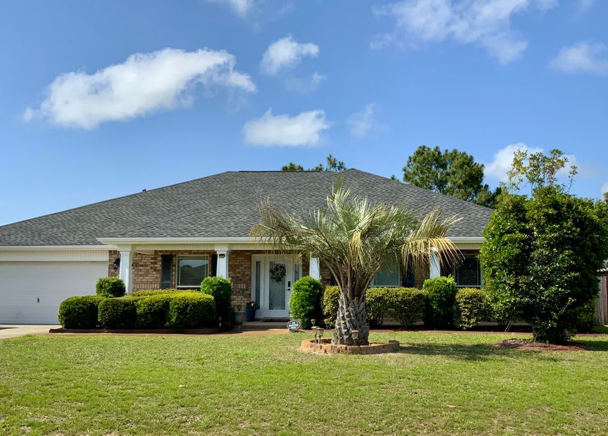 Brand new 30 year roof in 2024 *** Welcome Home!  If you're in need of a one story 2745 sf home with lots of upgrades and updates, this is it! The lovely covered porch with fresh paint beckons you to take a look inside this 4 bedroom, 3 full bath home.  Raised 10/12 ft ceilings, tray ceilings, bull nose corners, lots of crown molding and plenty of recess lighting throughout.  The kitchen is a cooks delight with granite countertops, center island, walk in pantry, new gas range with double oven and a reverse osmosis water system.  The dishwasher is new and has rarely been used.  The split bedroom plan allows for a perfect private retreat.  The master bath has a corner garden tub, double granite vanities, separate shower and 2 closets.  There is a guest room with private exit to the screened back porch and full bath making it perfect for a mother in law suite, office or 2nd master bedroom.  The other guest bedrooms share a full bath. French doors lead from the spacious great room to the screened in back porch.  A new 50 gallon gas water heater was recently installed and the exterior compressor is also new last year. For additional benefits there is a security system, storm shutters and a termite bond in place.   