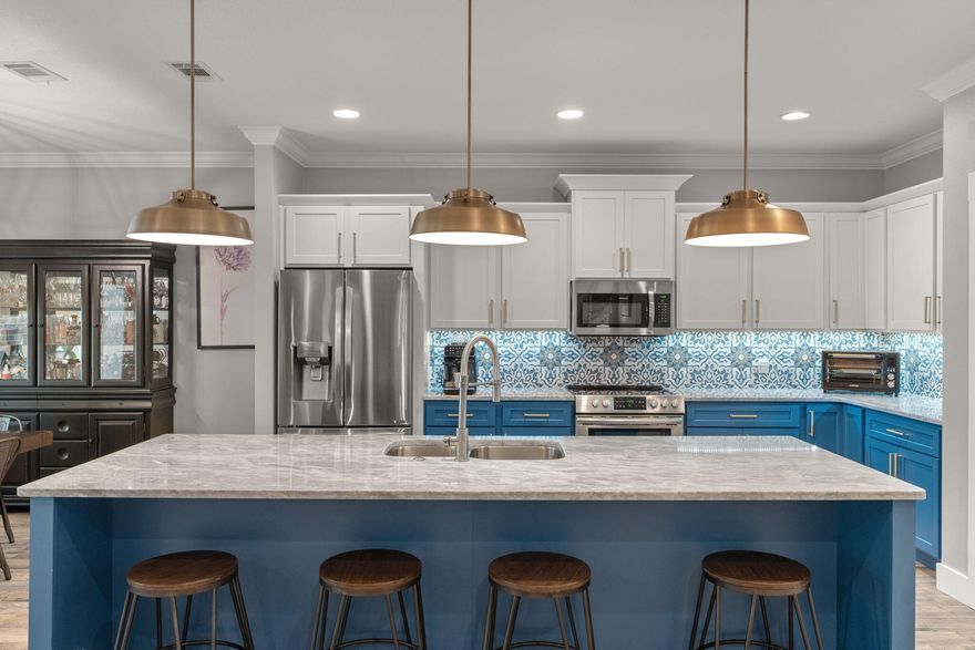 NO HOA! Built in 2019, this beautifully maintained 5-bedroom, 3-bath all-brick home offers exceptional space, modern upgrades, and timeless curb appeal with a welcoming covered front porch. Designed with both comfort and functionality in mind, the home features an open-concept floor plan, elegant finishes, and seamless flow between the kitchen, living, and dining areas--ideal for both everyday living and entertaining.Inside, you'll find new tile flooring that mimics hardwood throughout the main living areas, primary bedroom, and en suite bath, with carpet in the guest bedrooms. The living room and primary suite feature tray ceilings, while crown molding throughout the home adds an elevated touch of craftsmanship.The spacious kitchen is the centerpiece of the home, highlighted by a 10-foot island, granite countertops, stainless steel appliances, built-in microwave, soft-close cabinetry, and two pantry closets providing abundant storage. New lighting fixtures above the island, dining area, and entryway add stylish updates while the kitchen opens effortlessly to the living and breakfast areas for easy entertaining.

The private primary suite offers a relaxing retreat and includes a separate office or sitting area with sliding barn doors. The completely remodeled primary bathroom features a spa-inspired design with a tiled walk-in shower, freestanding soaker tub, shiplap accent wall, and designer wallpaper, creating a refreshing and tranquil en suite. The laundry room has been renovated with built-in storage and sliding drawers, offering both convenience and organization.

Step outside to a privately fenced backyard with a covered patio and plenty of room to add a pool. Garden enthusiasts will appreciate the raised vegetable garden beds equipped with their own sprinkler system, making it easy to maintain a thriving garden. A storage shed conveys as-is, providing additional space for tools and equipment.

Additional features include a two-car garage, thoughtful storage throughout the home, and a layout designed for both comfort and efficiency.

Conveniently located just 16 minutes to Hurlburt Field Air Force Base, 18 minutes to Eglin Air Force Base, and only 9 miles to the beautiful beaches of Okaloosa Island, offering an easy commute while enjoying close proximity to the Emerald Coast's sugar-white sand and turquoise waters.