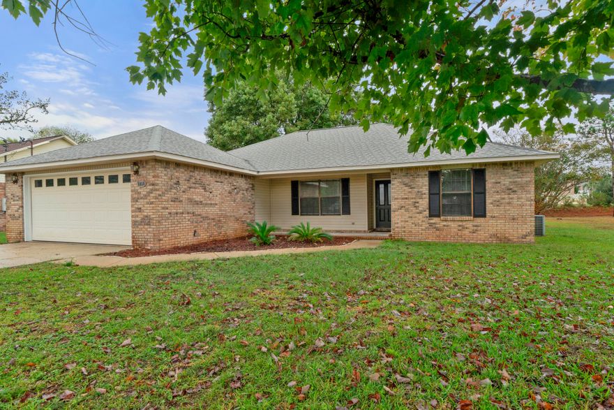 Wonderful brick ranch with a large yard and 2 car garage. This home has recently been repainted to include the trimwork and doors. ALL NEW carpet has been installed too. The home has a great open floor plan with split bedrooms, 2 on one side, and master on the other side. This home has an ample sized living room with stone fireplace overlooking the dining room and rear backyard. The master is near the kitchen just off the living room and overlooks the landscaped backyard. There is a lovely master bath en suite. The two additional bedrooms share a full bath with tub/shower surround.The kitchen overlooks the dining area and living room, and features stainless appliances and new range hood.