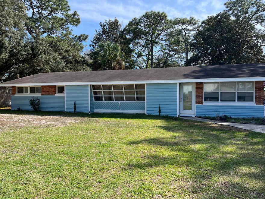 Three Bedroom, three bath home in the desirable neighborhood of Shalimar; Home is on a corner lot across from the Choctawhatchee Bay.  Home also has a large converted garage that is heated and cooled for large family room, den or bedroom with an outside door for easy access! Covered Drive through has lots of room for 1 or 2 vehicles; Home has formal dining area, large living area, and nice size kitchen with large pantry; Lot is large corner lot with .45 acre; Home does need some work; Home is across the street from Sara Plantation, a waterfront community;