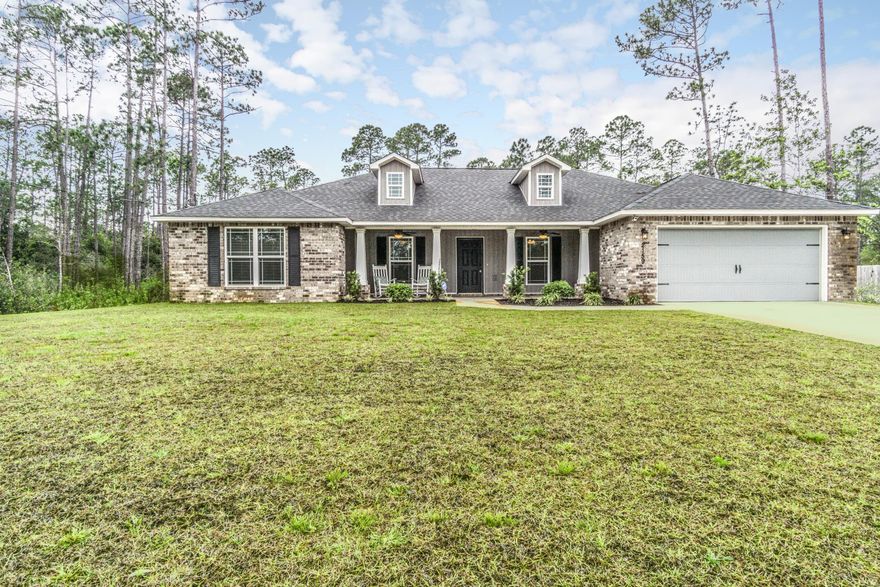 Situated in a quiet-cul-sac in Holley by the Sea, you'll love this almost new Craftsman style home! From the granite countertops, neutral color scheme, tile flooring, and open layout to the extra large, fenced-in yard and covered back patio, this one has it all. The kitchen offers granite countertops, undermount sink, recessed lighting, dark maple cabinetry, stainless steel appliances, and a hop up bar overlooking the living room. The split floorpan gives privacy in the master suite that has trayed ceiling in bedroom, double vanities with granite tops, two walk-in closets, and separate garden tub and shower. French doors open up to the covered back patio and fenced-in backyard surrounded by natural wooded areas. Purchase of this home includes membership to the Holley by the Sea