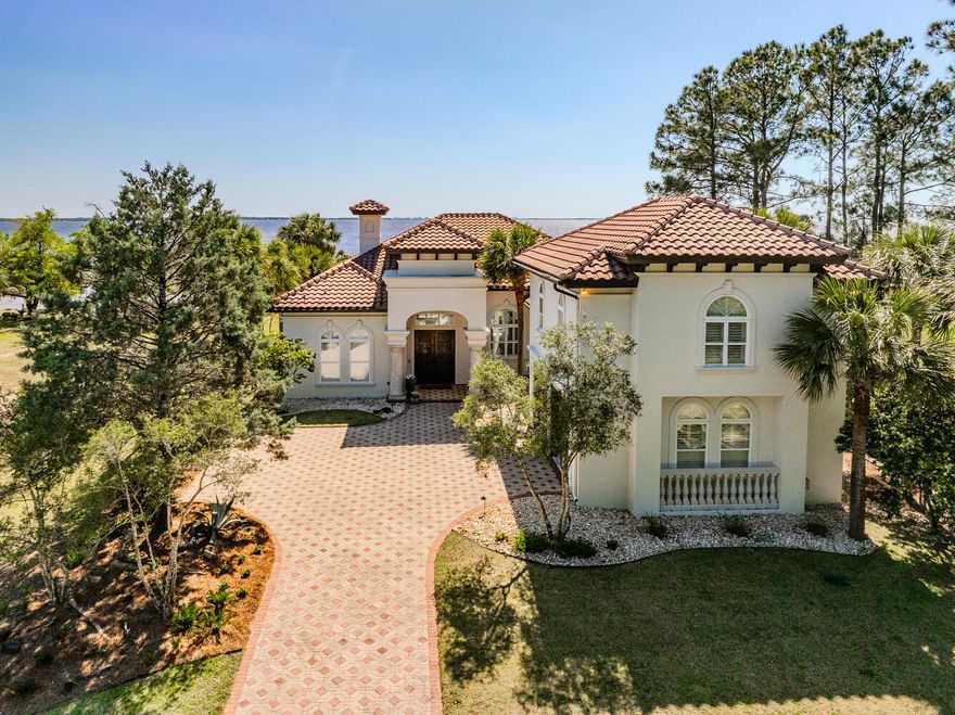 This remarkable bayfront property is truly a one-of-a-kind gem! With a dock featuring a swim platform built in 2021, and a thoughtful conversion for potential boathouse use, this home offers unparalleled waterfront living.A major remodel completed in 2022 has transformed the interior, including a completely new kitchen with all-new cabinets, fixtures, and appliances. Enjoy entertaining with ease thanks to the addition of a wet bar complete with an ice maker and wine cooler. The kitchen boasts three charming arched windows and has been expanded into an enclosed breezeway, creating a delightful sunroom.The living room features three sets of three-panel sliders, flooding the space with natural light and offering seamless indoor-outdoor living.