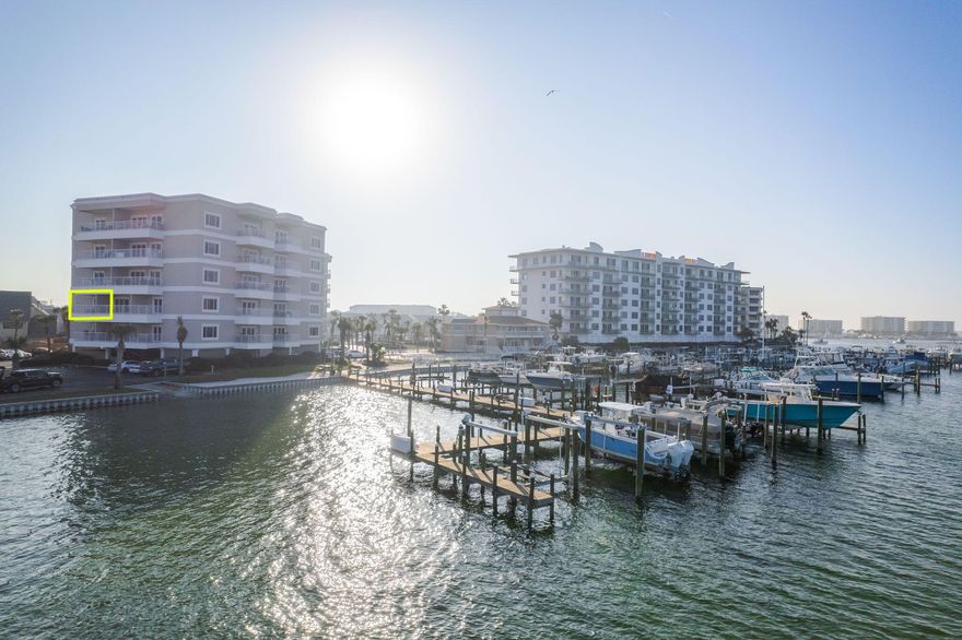 Whether it's your new full time comfortable residence or second home getaway, this coveted Holiday Isle condo with private boat launch and a $500 a year Boat slip option on the Destin Harbor- is truly the best condo in it's price range.  195 Durango Dr, Unit 3E, offers a rare opportunity to own a high-quality home in a meticulously maintained, gated community. This hidden gem is part of the Sun King Towers and Yacht Club, a gated twin tower complex directly on the fabulous Destin Harbor and canal. Just minutes by boat or water taxi to local restaurants and the famous Crab Island, this condo offers a relaxed, beach-centric lifestyle with ample recreational opportunities. This lovely two-bedroom, condo is turnkey ''Move-in Ready'' and comes fully furnished, including furniture, ROKU TVs, artwork, and appliances in the living room, dining room, bedrooms, and kitchen The interior features easy-to-maintain luxury vinyl plank floors throughout, freshly painted cabinets, and custom window treatments. The kitchen is a delight with its granite countertops, breakfast bar, stainless steel appliances, and a handy pantry for extra storage. Enjoy the spacious living room with expansive views, which leads to a large balcony, perfect for relaxing or entertaining. The second balcony off one of the bedrooms provides stunning views of Destin Harbor.
You'll appreciate the convenience of a stackable laundry space, a custom, walk-in California Closet, and ample storage options with multiple closets and locked owner storage on the first level. 

Feel secure with a gated parking lot and a secure building. Sun King Towers is pet friendly and features resort-style amenities, including a pool, private sandy beach, clubhouse with kitchen and exercise room, and a newly renovated 36-slip marina with power, water, a convenient fish cleaning station, and a commercial ice machine for your daily catch. 

This well-maintained complex was recently painted, has a new roof, resurfaced parking lot, and upgraded elevators.  Nearby, beautiful white sandy beaches await at multiple private beach access points, along with nearby restaurants and a local market. Enjoy miles of walking along the beach and Gulf Shore Drive, away from the hustle and bustle of central Destin and Highway 98. Sun King Towers is a perfect match for boaters, fishing aficionados, or anyone dreaming of a relaxing waterfront lifestyle. Please note: No short-term rentals - the minimum rental period is six months. Boat slips are available on a first-come, first-served basis, with rental only $500 per year, including power and water. The property includes four covered parking spots and four covered golf cart spots, also first-come, first-served.