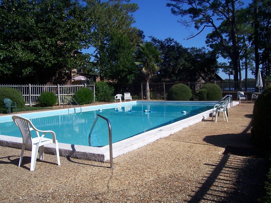 Live 5 minutes from Eglin Air Force Bases East gate. This waterfront complex has community room, pool, and boat docks (lease dock for a small monthly fee of $30). An open and airy floor plan that is extremely attractive. This home backs up to the pool & clubhouse. It has been updated and enjoys a great kitchen with pantry, downstairs master suite, spacious loft and upstairs, the home is updated, freshly painted, and mostly new flooring. Come see it today!! Go to facebook page at Hiddencovetownhomesassociation for more info on the community