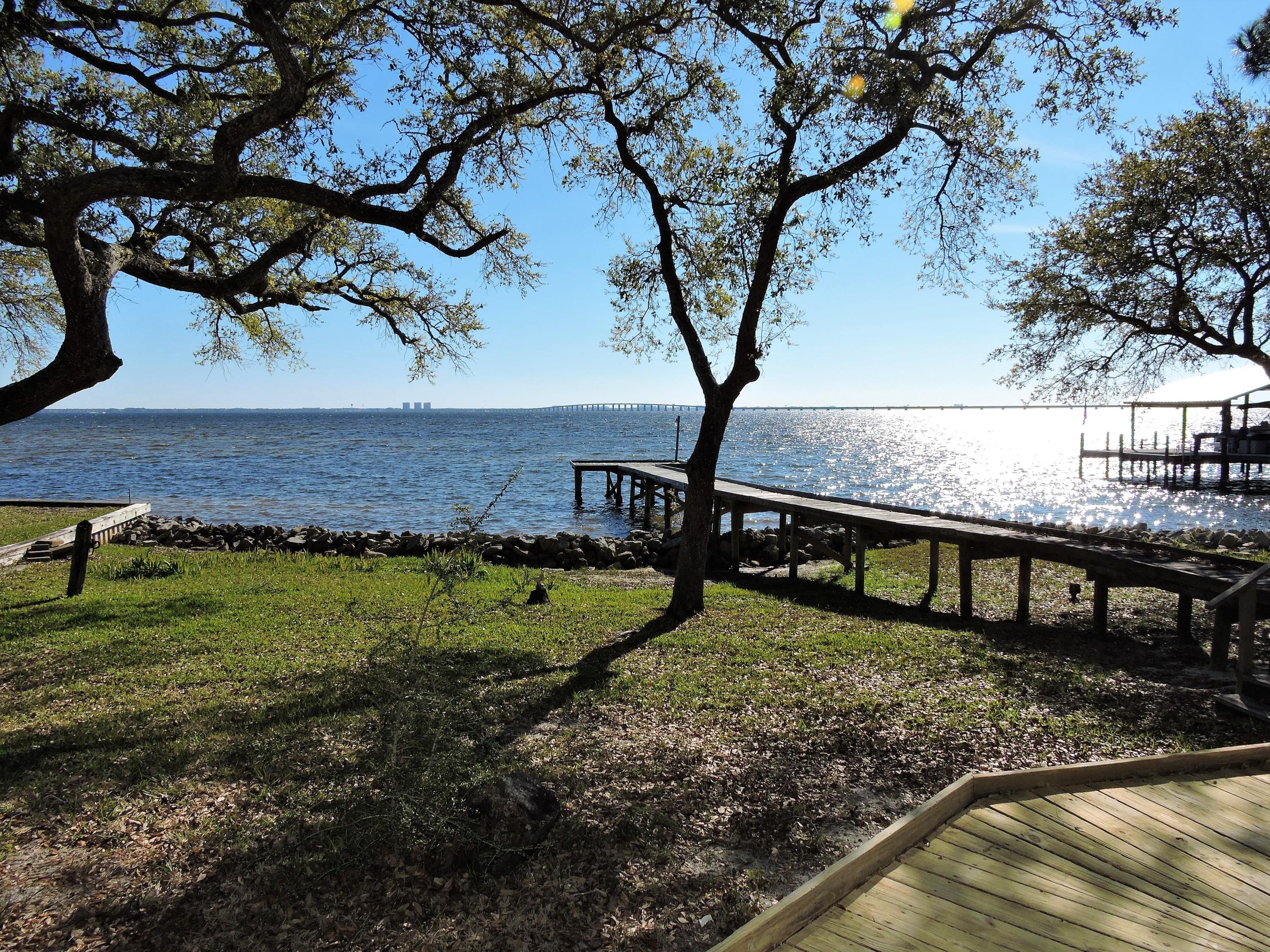 Beautiful Bayfront home (ZONE X,NO flood ins req, NEW ROOF 3/2015, Niceville Schools) in Lake Pippin Estates on a super private .89 acre lot w/a screened gazebo by the water. Walk in the double front doors & the bay view is INCREDIBLE! HUGE FIRST FLOOR Master Suite addition plus 4 more bedrooms & 3 additional baths. Beautiful hardwood floors & tile throughout. Master suite addition by Randy Wise. TRULY amazing gourmet kitchen w/high-end Orion granite counters & an abundance of upscale custom cabinetry w/soft close & SS appliances.Dual-sided fireplace separates living & family rooms. Formal dining has great view of the bay too!High quality Anderson windows. Beautiful marble tiles on kitchen back splash & tiling in showers. Terminix termite bond in place. Come see this beautiful home!