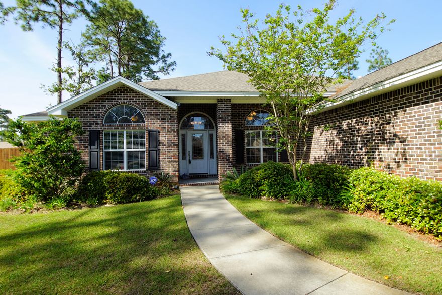 Welcome to Niceville and this custom built all brick home. This property has so much to offer! The 4 bedroom 4 bath home has 2 master suites, an office, 2 flex spaces, and sits on a half acre. You'll notice the large fenced corner lot, sidewalks and extra parking/boat space outside. Once you step inside you will feel right at home! You'll appreciate the open floor plan with so many features and no wasted space. Off to the right is the formal dining room or flex space that is highlighted by architectural columns and the office is to your right. The split bedroom floor plan includes a large master bedroom retreat along with a secondary master bedroom with it's own full bathroom. The highlight of the kitchen is the large breakfast bar where you can entertain the whole family!