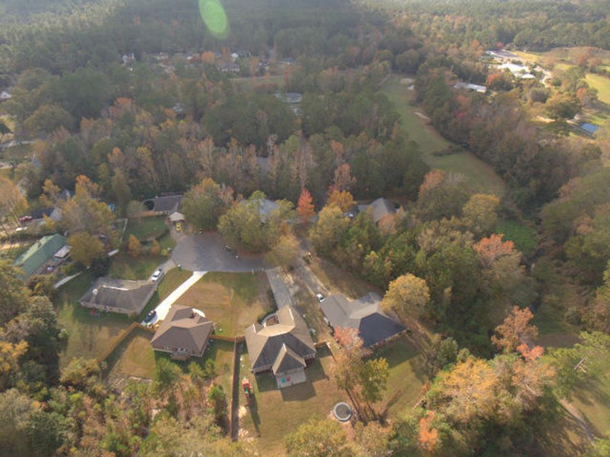 Wonderful all Brick, 4 bedroom, plus an office home located on the 17th green of the Foxwood Country Club golf course. The property is backed up to the 17th green and is separated by the woods and a small creek which provides a private and tranquil setting out back. The property is almost a half of an acre, has a new wood privacy fence, retaining wall above the creek and a large covered patio out back to relax on. It is located at the end of a very quiet dead- end culdesac street and is a great place to call home. Inside you will find many recent updates in the paint colors, lighting and plumbing fixtures and the tiled floors. There is a Mani-bloc plumbing system, high end stainless steel kitchen appliances and a Maple cabinetry. The office is near the foyer.