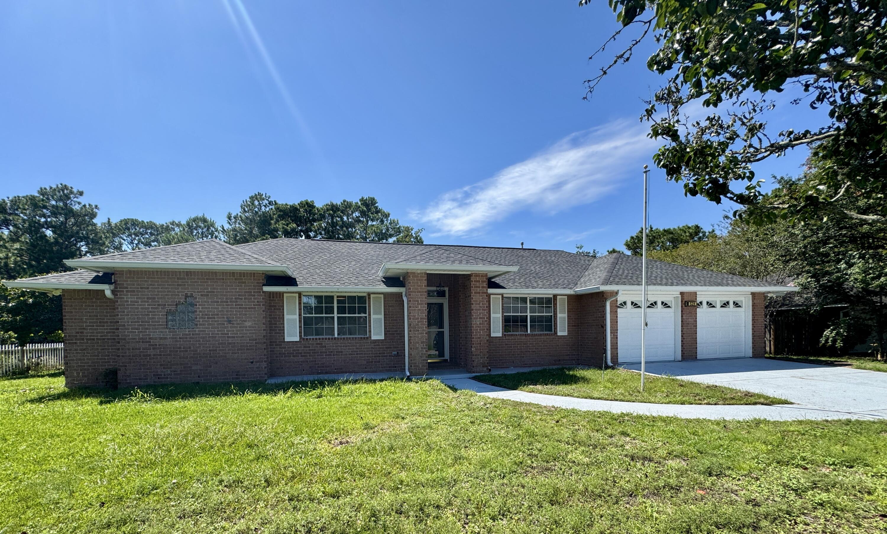 Beautiful Lakefront Home in Lake Charlene East! Just outside the gates of Pensacola NAS, this spacious brick home offers 4 bedrooms, 2.5 baths, and 2,423 sq. ft. of comfortable living. Nestled in a peaceful community on a picturesque lakefront lot, it's the perfect blend of convenience and tranquility. Inside, you'll find an airy, open floor plan with a cozy fireplace, a bright kitchen, a formal dining room, and dedicated office space. The climate-controlled Florida room provides year-round enjoyment with relaxing lake views. Rent includes lawn care for added convenience. No pets, no smoking, no vaping.