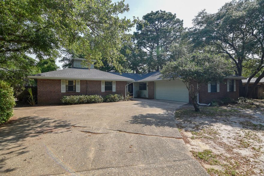 This is a *FRESHLY PAINTED* home with *BRAND NEW CARPET* and a *BRAND NEW ROOF* situated on a large lot in the quiet community of Raintree Estates. The spacious home offers 4 bedrooms, 2.5 baths along with an office, large living/family room, laundry room and a kitchen that is open to the dining room. The Master Suite features a walk-in closet, garden tub with shower and dual vanities. The kitchen has gorgeous custom made cabinets and granite countertops. Other features include a wood burning fireplace with a raised brick hearth, a large screened-in porch, ceramic tile, carpet, and crown molding. The courtyard entry garage offers a plethora of cabinets and a workbench.