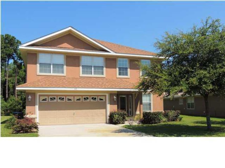 A 4 bedrooms/3 bath upscale home in Driftwood Estates! Features include corian kitchen countertops, stainless steel appliances, satin finish door handles, and much more! There is a bedroom and full bath downstairs. There is a very large kitchen with breakfast bar and french doors leading to patio. The living room has high ceilings and an electric fireplace too! The master suite has room for a sitting area, trey ceiling and the bath is lovely with a jetted bath and separate shower. The master closet is huge as well! This wonderful homesite backs up to the conservation area! Driftwood Estates has sidewalks, walking paths, lakes, bay access, a pool, and is close to restaurants and shopping and not too far from the beach!