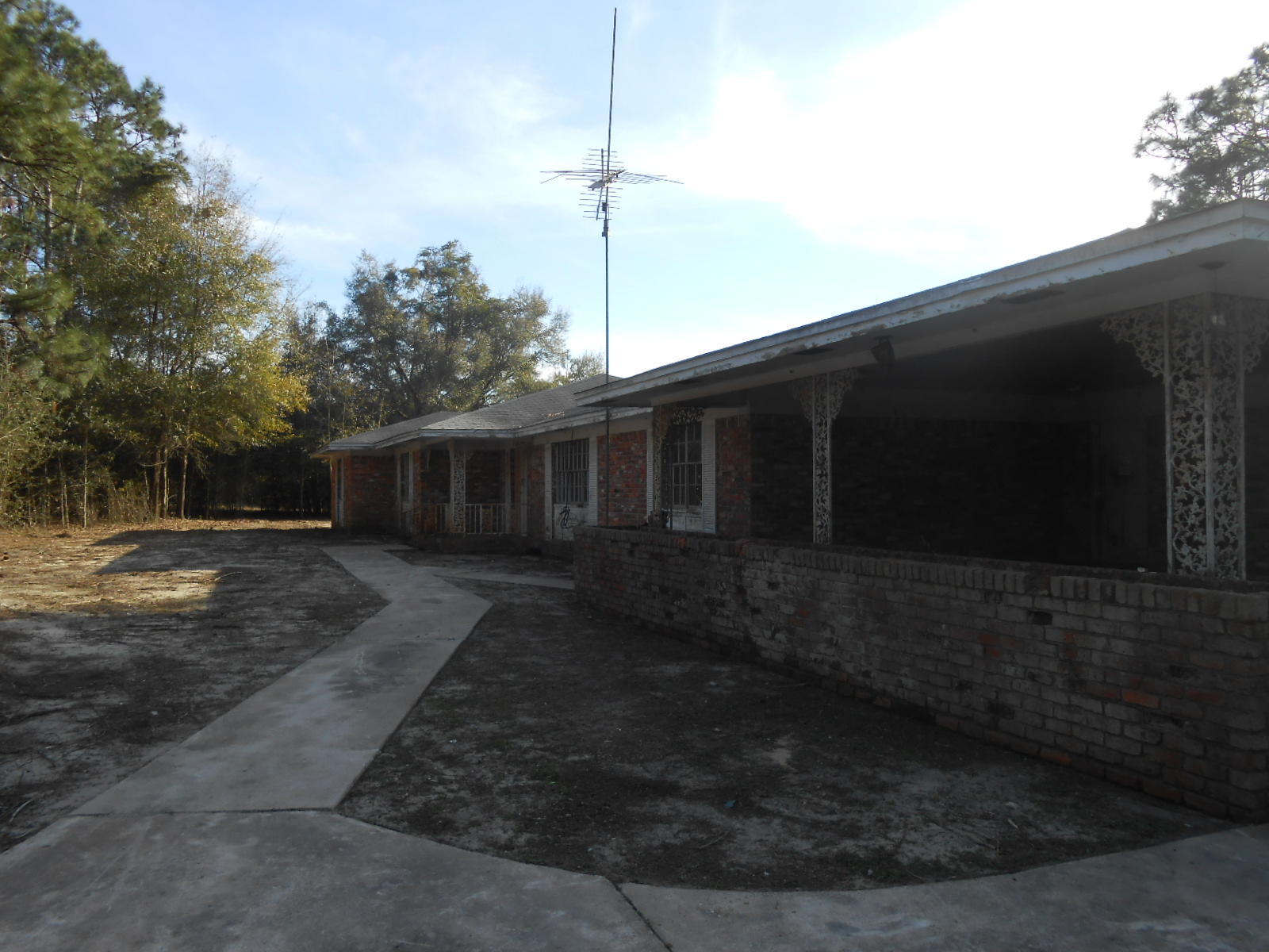 This HomePath by Fannie Mae property located just minutes away from Downtown Defuniak Springs sits on just over 5 acres. Home offers 2 master suites, 2 spacious additional bedrooms, living room and family room with brick fireplace. Back patio has brick fireplace and Bar b Que. If you are looking for a place to make your own this is the one for you. Call today for your private showing.