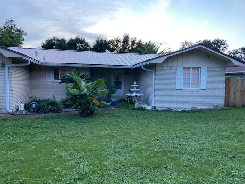 Blows up your Florida Bucket List, Central location to both air fields, Minutes to the Beach, Almost a half acre in the city, Beautiful Mother-In-Law Suite, New inground Pool, Florida Room, Standing Seam Metal Roof, 2 car attached garage plus 2 car detached garage & bonus work space, room for an RV Pad, Fenced back yard, Brick in a growing neighborhood.