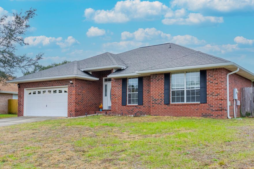Under contract with 72hr Kick out clause. NEW ROOF prior to closing  - $6k towards buyers closing costs AND an ULTRA LOW 2.25% Assumable VA Loan!! In the quiet, desirable neighborhood of Waterstone, this spacious all brick home with updates, is on a 0.27 acre lot. Featuring Luxury Vinyl Plank & Tile floors throughout with NO CARPET, this home offers a HUGE Great room with vaulted ceilings, whilst the Kitchen features Granite Counters, a breakfast bar and newer LG stainless appliances, perfect for cooking and entertaining. The Master suite comes with a XL walk-in closet, garden tub/shower combo and a granite topped double vanity. The 3 additional guest bedrooms are a good size sharing a second updated bath Heading outside, you'll find a good sized, flat, fully fenced back yard, plus the added benefit of whole home gutters and a 2 car garage. Located near top-rated schools, bases and Navarre's stunning, white sand beaches. Come check out this great home today!