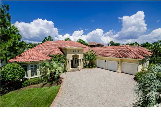 Lovely 4 bedroom, 4 bath home on a great lakefront lot in Sandestin Golf and Beach Resort's most exclusive private gated neighborhood Burnt Pine. This custom home was built by Sweet Homebuilders and is a wonderful place to call home. Kitchen has custom cabinets, island with solid surface cook top, chef's pantry, GE profile appliances and more. Great room has wet bar. Large master suite with brand new carpeting has two walk-in closets, bath with whirlpool-jetted tub, large separate shower and double vanities. Roomy office could be used as a bedroom. Large laundry area with storage cabinets and sink accommodates a freezer or additional refrigerator as well as washer and dryer. Large three-car garage with separate golf cart entry. Back patio has built-in grill and beautiful large pool