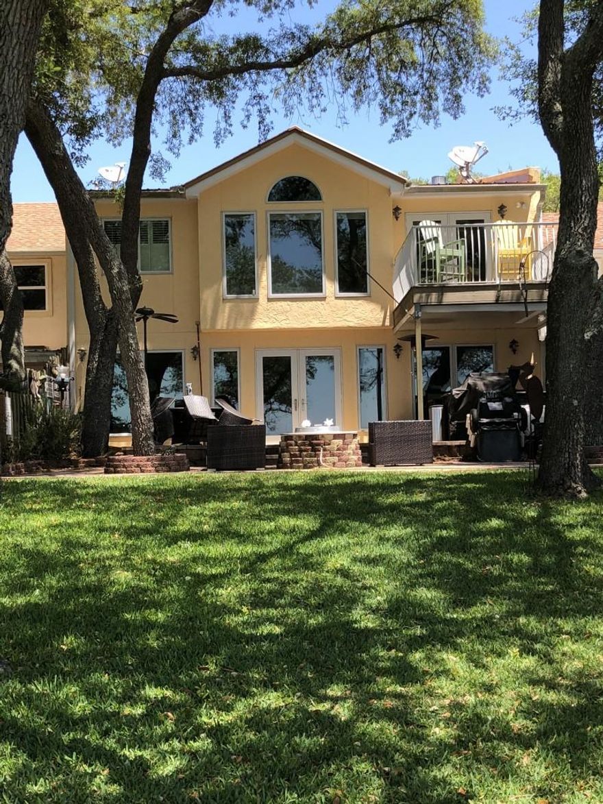 Beautiful luxury townhouse located on the water. The townhouse was fully remodeled in 2006 with top of the line appliances, Meile, Subzero, convection cook top and tankless hot water heater. It is located near Two Georges Marina and comes with 4 boat slips and ownership in two separate docks. Granite counter tops throughout the house including the outdoor grilling area, Pella windows and doors, porcelain tile throughout . Wet bar with ice maker and wine cooler. The expansive outdoor patio area includes a covered built in grill and fire pit both on natural gas. Sprinkler system installed in beautiful backyard. Sit out and enjoy a cocktail while viewing the beautiful sunsets from your own slice of paradise. Two boat lifts and jet ski lift included. Direct access to Destin and the Gulf of