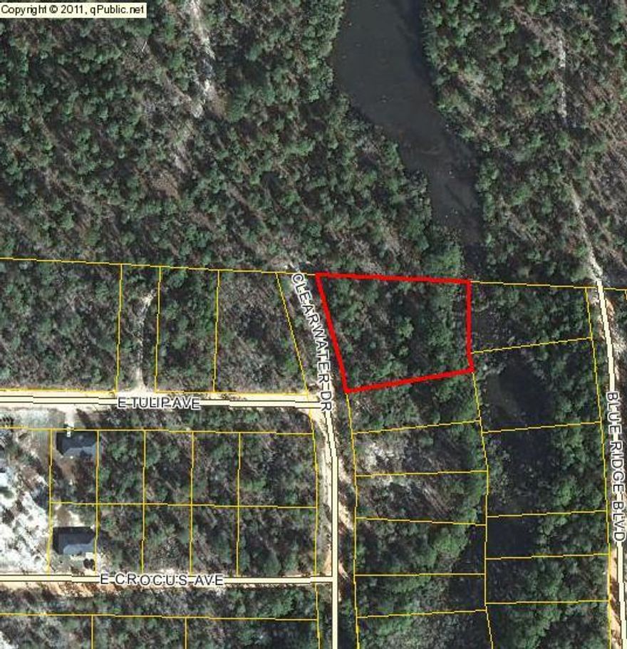 2 Nice wooded lots on small stream. Close to town, beaches, and interstate. Priced for quick sale.