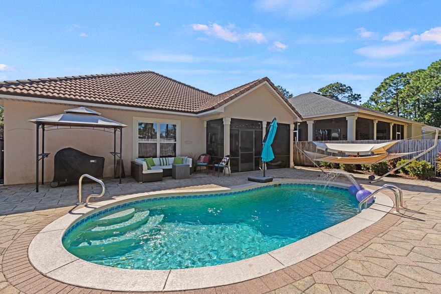 PRICE REDUCTION!!Welcome to your dream home, This stunning 4-bedroom, 3-bathroom residence offers a perfect blend of coastal luxury and modern comfort. Nestled in a peaceful neighborhood just minutes from the sugar-white sands and emerald waters of the Gulf of Mexico, this home is ideal for both full-time living or as a vacation getaway.This home boasts an open-concept living area with high ceilings, large windows, and abundant natural light. The living room flows seamlessly into the dining area and gourmet kitchen, perfect for entertaining.Chef's kitchen features granite countertops, stainless steel appliances, custom cabinetry, and a large island with bar seating. Step outside into your backyard oasis! The private pool is perfect for relaxing on warm summer days or hosting outdoor gatherings. The patio area is ideal for sunbathing or dining al fresco. 

The luxurious master bedroom includes a walk-in closet and an en-suite bathroom with a soaking tub, dual vanities, and a walk-in shower. It's your own private retreat at the end of the day.

Three generously sized guest bedrooms provide plenty of space for family and visitors. The additional bathrooms are beautifully updated and offer convenience for a growing family or vacationing guests.

Located just a short drive from Destin's world-famous beaches, shopping, dining, and attractions, this home offers the perfect balance of privacy and convenience. Enjoy the best of coastal living with easy access to golf courses, marinas, and outdoor adventures.

Whether you're looking for a primary residence or a vacation home, this property has it all.
