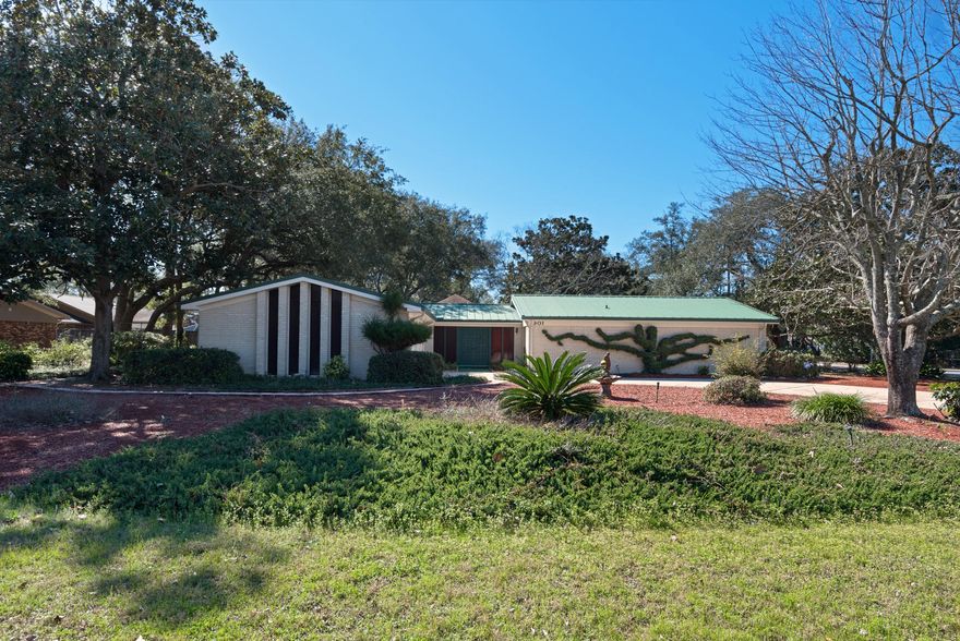 Excellent neighborhood. Well loved. Recent interior paint throughout. This 4 bedroom, 2.5 bath home is a delight. Located in Magnolia Shores within minutes to schools, parks, shopping, the bay, and restaurants. Beautiful open concept kitchen renovated in the early 2000s white cabinets, laundry closet and display bar. Living space is cozy with gas fireplace for those cool FL nights. Huge screened in porch overlooking the natural plants and peaceful backyard. Zero carpet with hard surface flooring throughout. All bedrooms generous in size. The master bedroom has built in desk with extraordinary organization in the master closet. The master bath has shower/tub combination. Newer metal roof. Newer AC unit. This home is being sold as-is with right to inspect. The two-car garage is spacious an