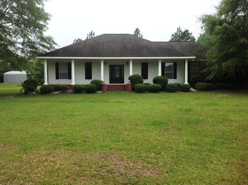 This custom built home is a must see! Located on 5 acres this property boasts three outside storage areas. One of which IS set up as a shop with air conditioning, electric, water and bathroom. This home contains many upgrades including granite countertops,high ceilings,cultured marble, and decorative concrete floors throughout. Room for horses and could even turn one shed into a single stable if wanted. there is also creek frontage on the backside of the property No restrictions. Must see to appreciate.