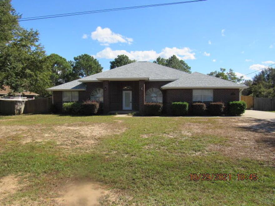 Lovely  brick 4 bedroom, 3 bathroom home in Holley-by-the-Sea with a side entry garage and new roof installed in October 2021.  1/2 acre lot. Luxury vinyl planking throughout home.  Kitchen has breakfast bar, maple cabinets, double oven and cooktop. 16 x 16 workshop with electricity in back yard.  Privacy fenced back yard with lawn pump on sprinkler system on well.