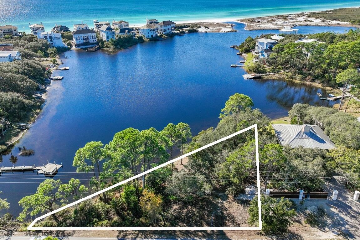 NEW PRICE! Unparalleled Coastal Dune Lake Homesite. Ultimate coastal luxury with this rare dune lake homesite in Dune Allen Beach. Enjoy breathtaking views and sunsets over Stallworth Lake of the emerald Gulf waters and direct access to pristine sugar-white sands just a short walk away. Own a piece of paradise on this extraordinary 0.34-acre dune lake-front home site with 169 feet of waterfront and the unique opportunity to build your dream home in one of South Walton's most sought-after locations along 30A. Immerse yourself in the vibrant 30A lifestyle, just moments away from world-class dining, shopping, and entertainment at Grand Boulevard, Gulf Place, and Seaside. A portion of the site is in Flood Zone ''X''. All information is deemed accurate and Buyers should verify for their needs. Survey and rough building footprint in documents.