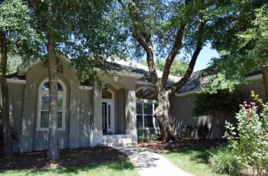 The upstairs level is ideal for many family situations and offers an additional master suite, which includes a huge walk-in closet and another large heated/cooled storage space that is perfect for your holiday decor. The upstairs suite also has it's own morning kitchen and 10'x10' covered veranda with travertine flooring that gives it a tree house feel. This second level, which also includes a finished room over the garage, is ideal for an older teen, mother-in-law suite or for your visiting guests to have their own space. These flexible upstairs areas could alternatively be used as a media center, additional play spaces or an office. The backyard is small but features a large tiled patio, which is perfect for grilling, relaxing or accommodating any of your entertainment needs.