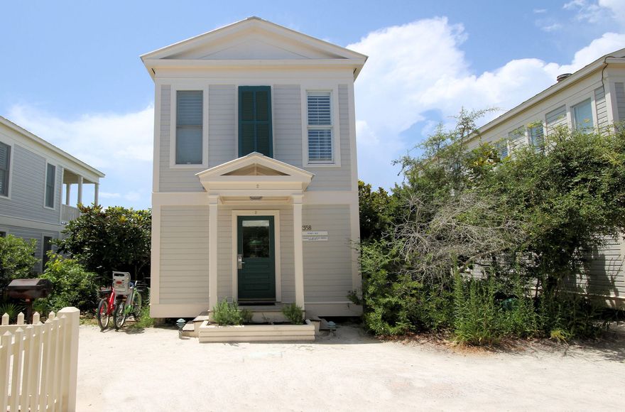 Located in the community of Seaside, selected by Time magazine as one of its Designs of the Decade. This classic Florida beach cottage was modeled on Thomas Jefferson's Cottage at Monticello. A two story cottage beautifully set into the dune, finely crafted, yet an unpretentious hideaway. Designed by Scott Merrill, it was awarded a National American Institute of Architects Award of Excellence. The all wood interior is painted a crisp white. Master bedroom with steam shower, private screen porch with outdoor whirlpool tub surrounded by a natural grove of oaks, all on first floor. The living area with extended ceiling is surrounded with windows allowing light to fill the entire second level. Build a fire in the wood burning stove to warm those chilly winter evenings. Assigned parking easement transfers with sale. Roof replaced and exterior painted 2016. Interior  updates in process- refinishing floors, replacement of windows screens and addition of interior window shutters.