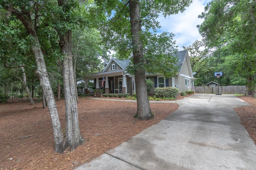 As you enter the quaint 27 home neighborhood of Fischer's Landing, you will quickly realize that this neighborhood is a step back in time to Old Florida. The canopy of oaks, hickory, and magnolia trees create a natural setting and an immediate sense of relaxation. The private community dock offers immediate bay access for swimming, paddle boarding, and some of the best fishing Choctawhatchee Bay has to offer. Located directly in the heart of the subdivision is 177 N Blue Heron Dr, a custom built craftsman style cottage constructed in 2012. This 4 bedroom 3 full bath home is the perfect mixture of modern day amenities accented by classic Florida cottage charm. Curb appeal is abundant with the inviting front porch, craftsman style columns, and low maintenance hardy plank siding. The pride of