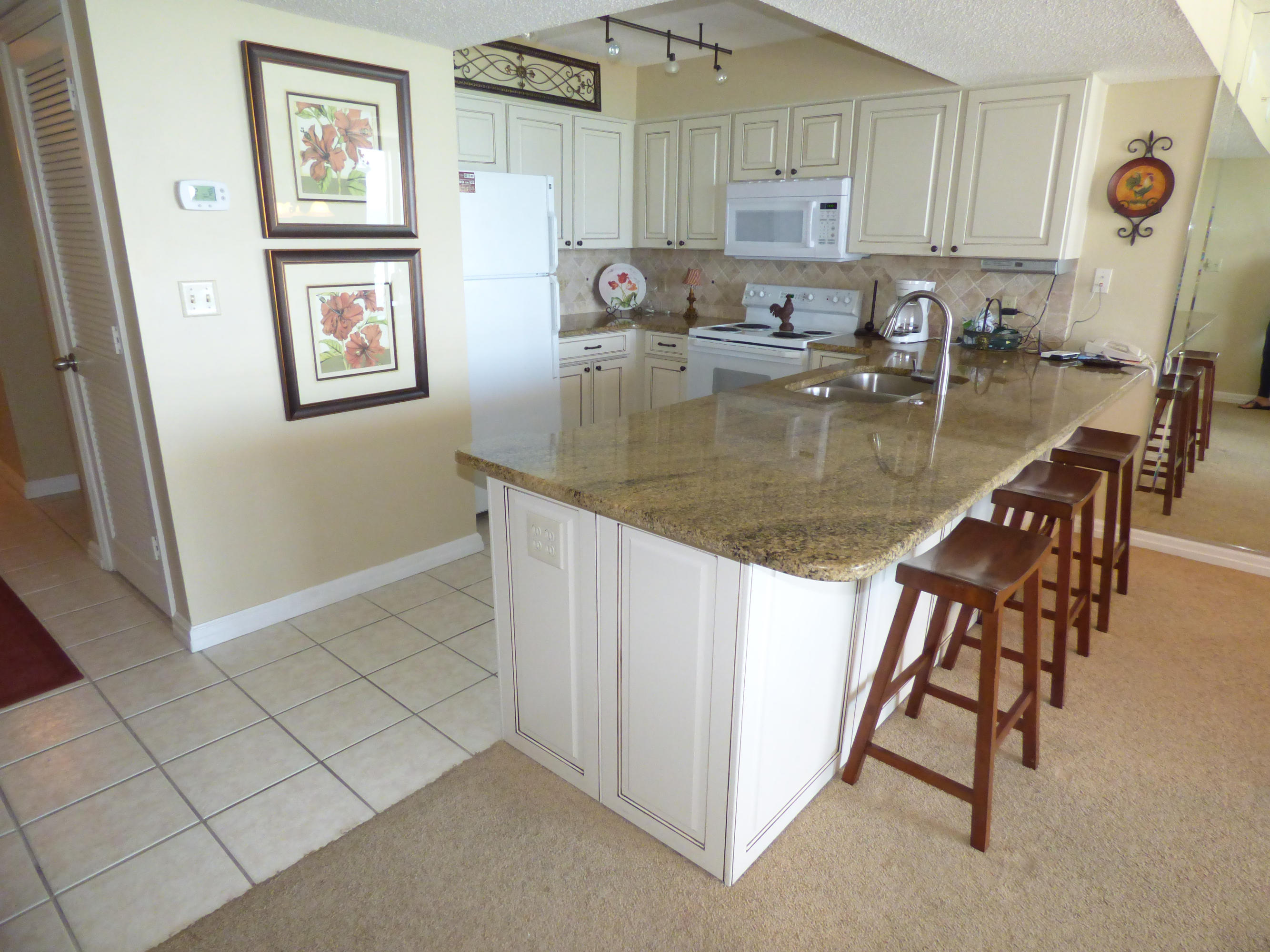 Beachfront beauty in the perfect location to optimize rental income. Upgraded granite, gorgeous wood cabinetry, new microwave and dishwasher. HVAC new in 2015. Fresh paint,custom built-in bunk beds. Amenities include 3 pools, sauna, steam room, cafe, Tiki bar, spa, large open deck, tennis courts. Cross easement with the Terrace at Pelican Beach Resort allows for the enjoyment of their amenities as well. Picture over master bed does not convey. Income in 2015 30,732. 30,538,99 as of 11/30 this year.