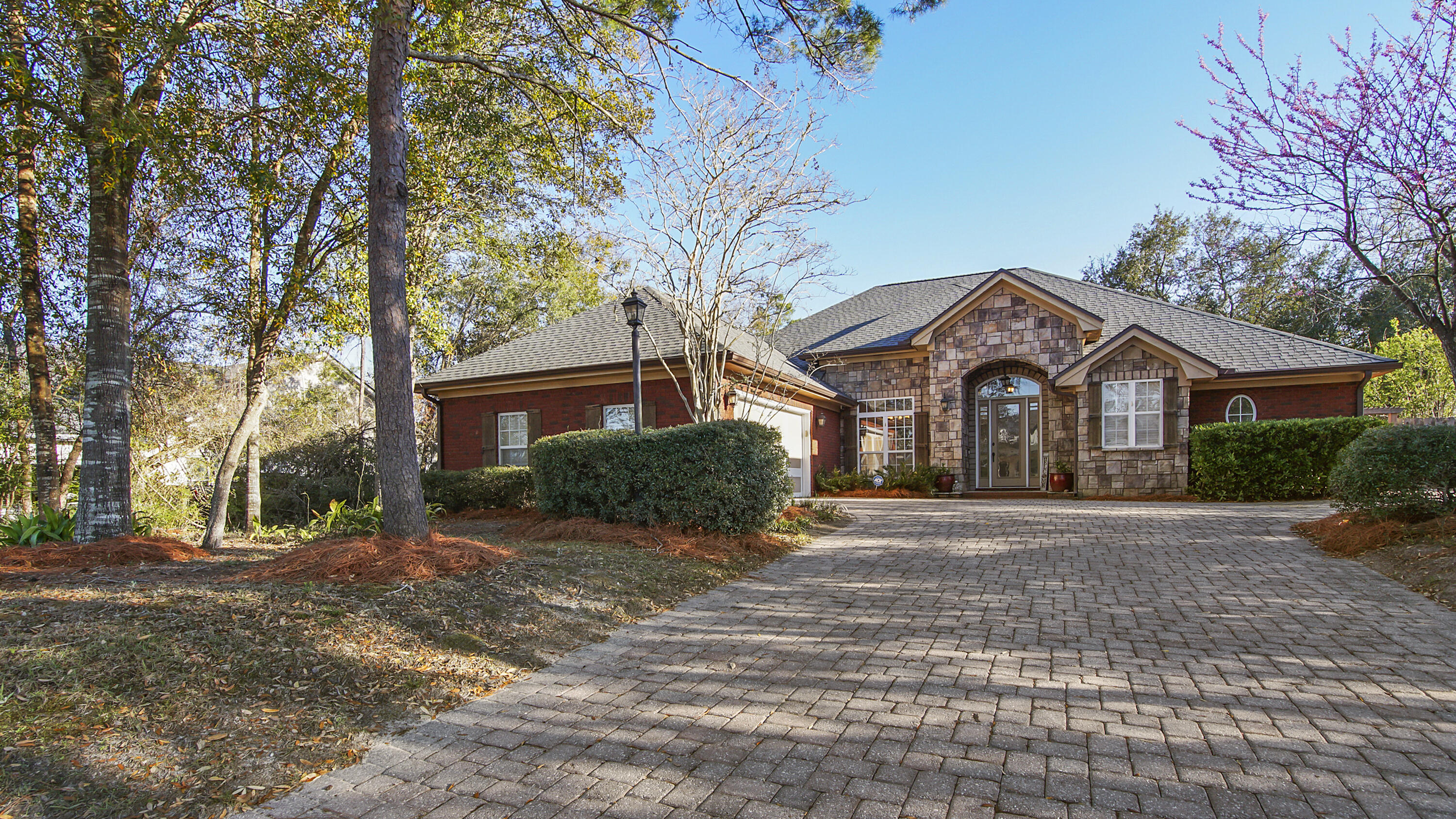 Welcome to your dream home! This custom-built masterpiece sits on over half an acre, offering luxury, comfort, and top-tier functionality. From the moment you arrive the brick driveway and grand entrance set the tone for the exquisite details throughout. Spacious Layout with large built-in closets in every room (California Closets) Bamboo flooring in bedrooms - scratch-resistant and durable. Crown molding throughout, adding a touch of elegance. Built-in entertainment center & permanently mounted mirrors enhance the living space Jet spa tub in the primary suite with a separate toilet room, Gourmet Kitchen Walk-in pantry with ultimate organization Enclosed Florida room with private primary entrance for relaxation Don't miss out on this rare gem! Schedule your private tour today