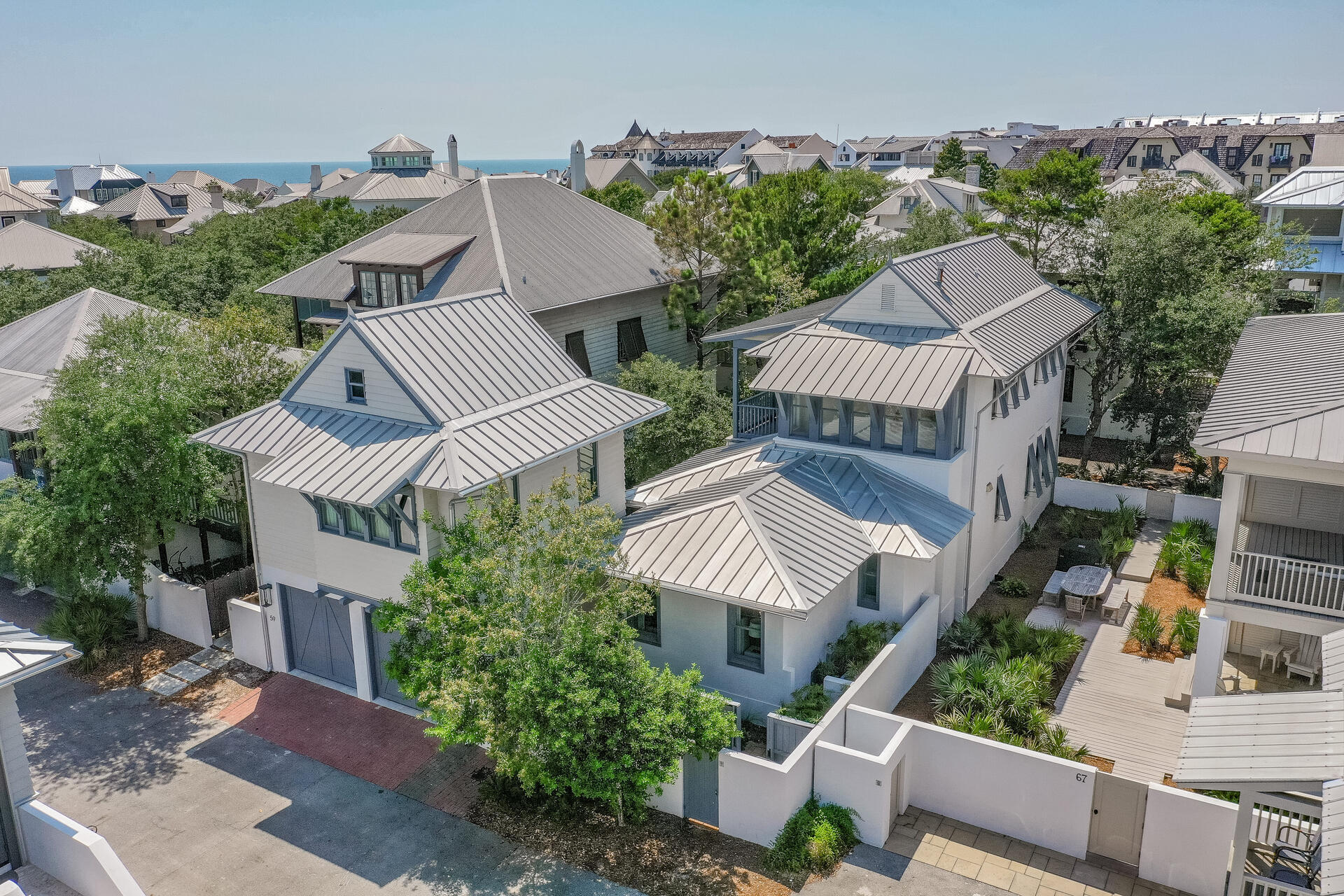 Originally built in 1999 and extensively remodeled in 2016, including a first floor primary bedroom and bath addition, this stunning home offers a relaxing coastal retreat in the heart of Rosemary Beach.  The carriage house, with full kitchen and separate bedroom was also built in 2016, along with the private pool.  Perfect for full time living, a second home (it has been both since newly built) or a vacation rental with rental projections of over $261K.  The large, chef's kitchen provides plenty of space for multiple cooks and helpers - subzero refrigerator is just a few years old.  Thoughtfully designed, the primary, first floor bedroom has a large walk-in closet with built ins and an ensuite bath with double vanity and a separate shower and soaking tub.  Custom built bunks are outfitted