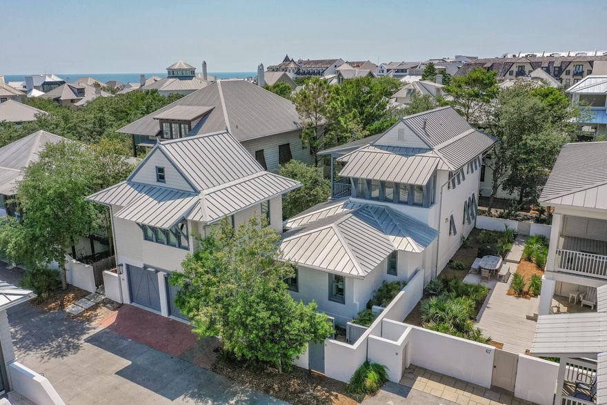 Originally built in 1999 and extensively remodeled in 2016, including a first floor primary bedroom and bath addition, this stunning home offers a relaxing coastal retreat in the heart of Rosemary Beach.  The carriage house, with full kitchen and separate bedroom was also built in 2016, along with the private pool.  Perfect for full time living, a second home (it has been both since newly built) or a vacation rental with rental projections of over $261K.  The large, chef's kitchen provides plenty of space for multiple cooks and helpers - subzero refrigerator is just a few years old.  Thoughtfully designed, the primary, first floor bedroom has a large walk-in closet with built ins and an ensuite bath with double vanity and a separate shower and soaking tub.  Custom built bunks are outfitted