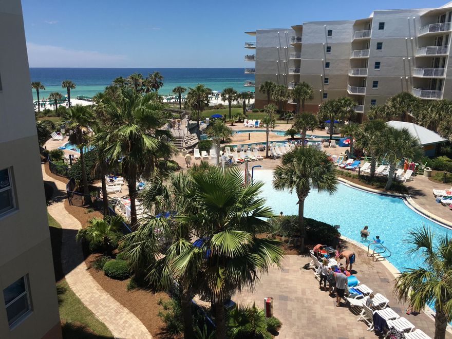 Experience wonderful views from this 4th floor 2br/2.5ba w/bunks 1292sf top of the line condo. This fully furnished rental ready unit has a split floorplan. Both the master and the guest bedroom (complete with private bath) have doors to the private balcony overlooking the pools below. In addition, there is a half bath and a bonus bunk area so the unit sleeps 8! This unit has a great floor plan with granite counters and stainless steel appliances, and crown molding. There is even a separate owners storage in hall just outside of the front door. This complex has just about the BEST ameninies anywhere with 490' of beachfront, several pools (about 10,000sf), a complete fitness center, 2 hot tubs, a splash pad, many grills, a kiddie play park, a lazy river, and