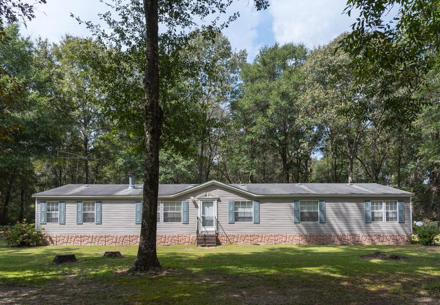 Looking for a peaceful, country lifestyle just down the road from Florida's Highest Point! This 23+ acre property features a well maintained, immaculate 4 bedroom, 2280sqft home. Chicken coop and Playhouse are included! This home contains a large kitchen/dining area with a pantry and lots of storage, fireplace in the living room, study/office area, split bedrooms, family/hobby room with wet bar to entertain. The home is situated a good distance from the road and surrounded by full grown oak and pecan trees. Acres to explore, a playhouse to pretend and a basketball court to play on. A must see to appreciate. Located East of Florala, North of Defuniak and West of Samson and just ONE hour to the beach. Second home, primary home or hunting getaway this property is a must see to appreciate!
