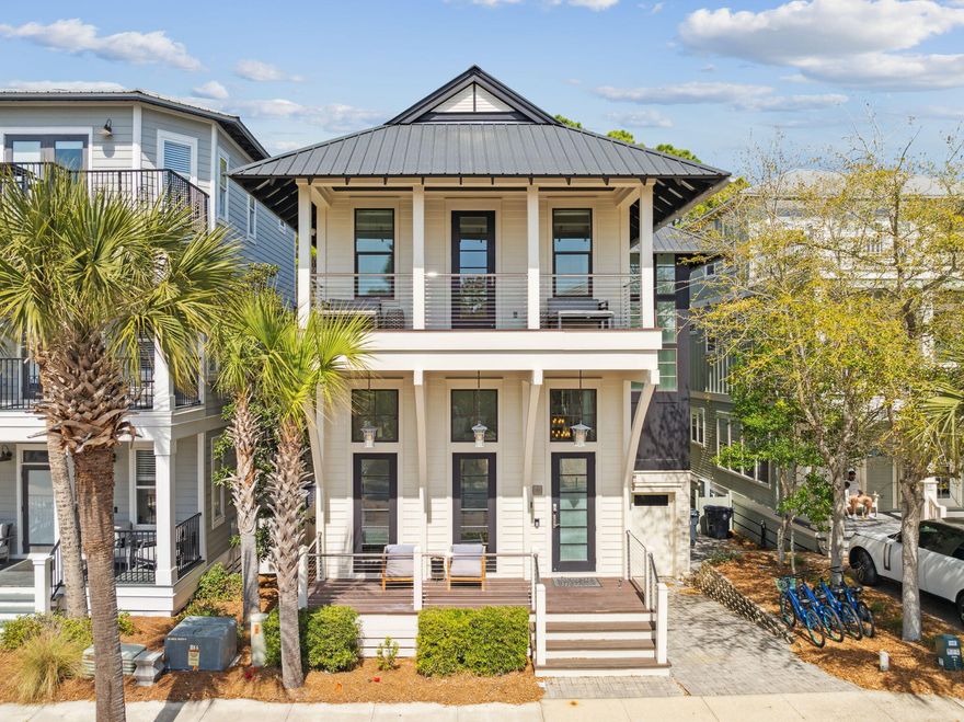 Welcome to 200 Blue Crab Loop in Seacrest Beach! This stunning 30A dream home has been custom-built to host an extraordinary experience at the beach. Located in the heart of Seacrest Beach, this property presents an exceptional floor plan with five bedrooms, a home gym, two separate living rooms and multiple levels of outdoor living spaces. This beautifully designed home flaunts a summer kitchen on the first floor, luxury pizza oven on the second floor balcony, and gas fireplace on the third floor balcony. The meticulously-curated interior has hardwood floors, large transom windows and unique floating stairs. The well-appointed chef's kitchen is equipped with double Fisher Paykel refrigerators, durable granite countertops, a 48 inch Thermador gas range, and an oversized pantry. The main living room showcases nano doors leading out to a rare two-story atrium. The living room is furnished with modern seating along with a beautiful fireplace and wood mantel. The entrance to the home displays an airy foyer which is adjacent to a primary bedroom with an ensuite bathroom. The ground level features a massive guest bedroom, custom built-in bunk beds and a gorgeous home gym filled with natural light. This ground level has a spacious living room with access to the screened-in summer kitchen. The top floor has two primary suites with vaulted ceilings, a fully-equipped laundry room and a breathtaking screened-in balcony. The home is offered fully-furnished and rental-ready. Official rental income projections are set at $150,992 annually. Inquire to receive rental income information and estimated expenses for the property. Reach out today to schedule a virtual or in-person showing.