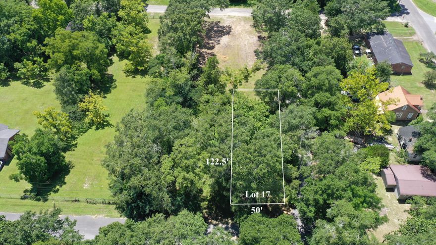 This beautiful parcel is located in Defuniak Springs city limits. Property has been mostly cleared and is ready to be built on. The zoning is R-2 residential multifamily which allows for single family and multifamily dwellings. Public water and public sewer hook-ups are available.