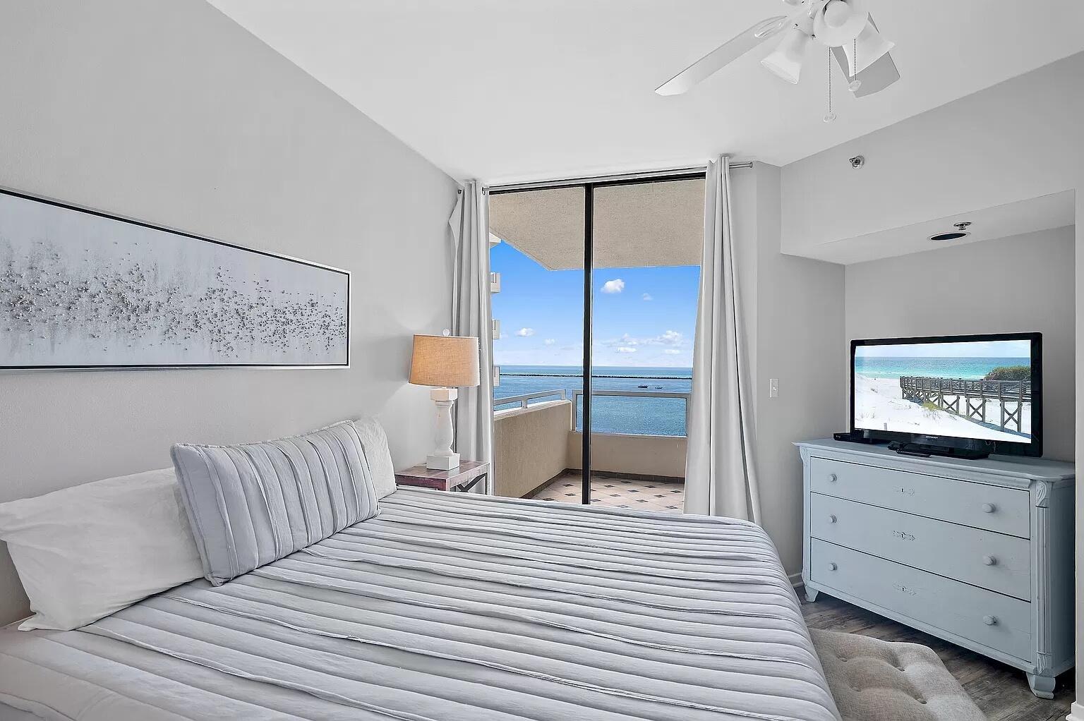 Nestled in the coveted East Pass Towers, this 2BR/2BA condo offers stunning views of Destin Harbor and the Gulf. Enjoy an open layout with floor-to-ceiling glass doors, a modern kitchen with granite counters and stainless appliances, and a spacious balcony perfect for watching boats and dolphins. The king suite boasts balcony access and a spa-style ensuite, while the guest room includes a queen bed and nearby full bath. This gated community features a heated waterfront pool, hot tub, private beach access, marina, and water taxi to HarborWalk Village. With in-unit laundry, free Wi-Fi, and reserved parking, this coastal retreat offers both comfort and convenience in one of Destin's most serene settings.