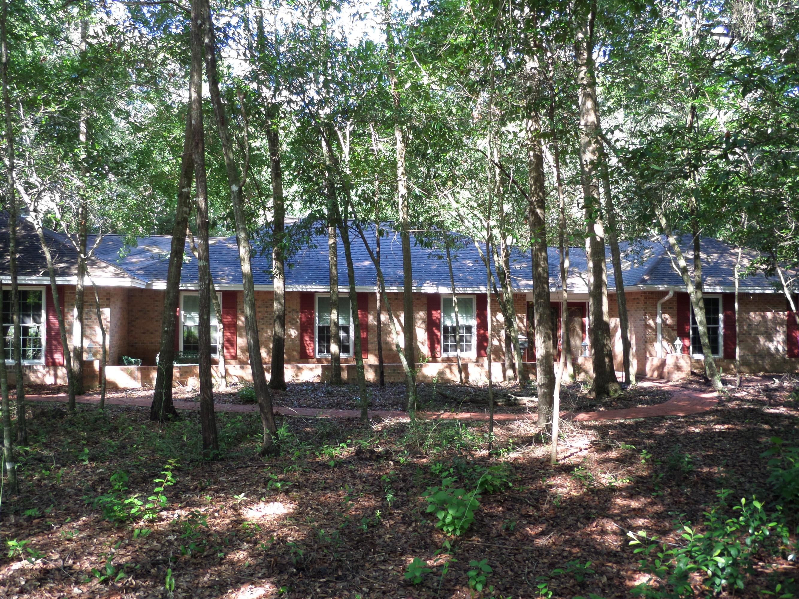 Large Brick Ranch on a double wooded fenced lot located on the 7th Fairway of the Golf Course. This home has a private setting with an expansive patio and in-ground Pool for family enjoyment and entertaining. The home has an open concept that can be decorated various ways, with a Recreation/Media room or space for additional bedrooms if needed. The Kitchen features granite counters with a breakfast area and is open to the family room which has a wood burning fireplace.The living room/dining room is an open concept area.This property is ready for you to decorate, and is a must see.