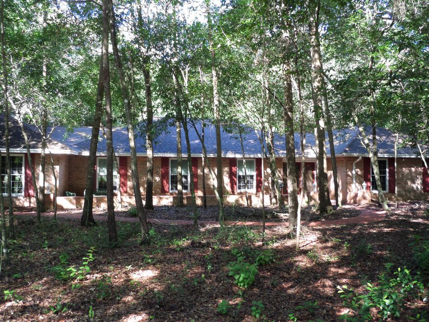 Large Brick Ranch on a double wooded fenced lot located on the 7th Fairway of the Golf Course. This home has a private setting with an expansive patio and in-ground Pool for family enjoyment and entertaining. The home has an open concept that can be decorated various ways, with a Recreation/Media room or space for additional bedrooms if needed. The Kitchen features granite counters with a breakfast area and is open to the family room which has a wood burning fireplace.The living room/dining room is an open concept area.This property is ready for you to decorate, and is a must see.