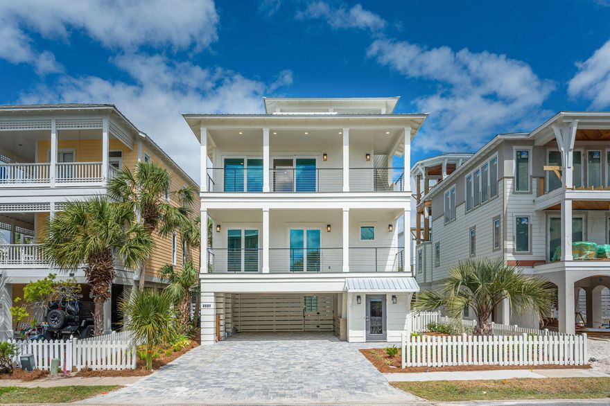 One of the last new construction opportunities in Destin Pointe! This beautiful coastal getaway is thoughtfully designed to maximize rental potential without compromising livability as your permanent residence or private vacation retreat. The ground floor offers a gracious amount of space for multiple vehicles, golf carts, and the storage you need. Just beyond, you'll find a stunning inside/outside saltwater swimming pool that offers both refreshing, shaded comfort as well as sun-drenched fun. This custom-designed amenity is the perfect way to refresh and relax after a day at the beach. Moving inside, you'll discover the highly desirable inverted floor plan that is accessed through a conditioned, ground floor entry. From here, you will access the first living