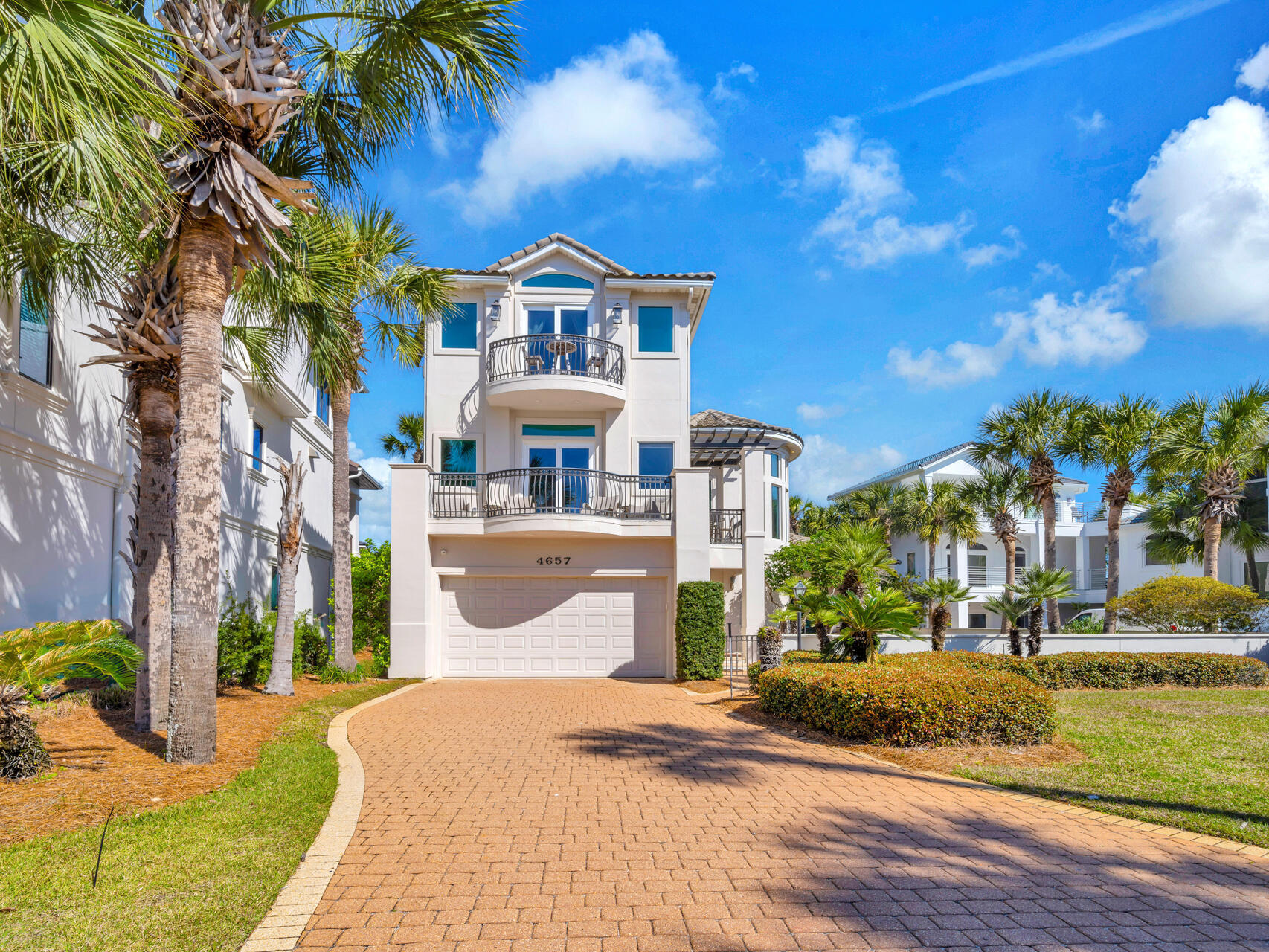 Welcome to the prestigious gated community of Destiny Way located across the street from the white sandy beaches of the Gulf of America and near Four Prong Lake. Public beach access is directly across the street, making this an unbeatable coastal retreat and also a previous Parade of Homes winner.  Custom double front doors and stately pillars, open to a beautiful foyer with a grand spiral staircase that leads to the open concept main living, dining and kitchen on the second floor. Inside you will find coastal-inspired modern furnishings and newly-painted and renovated interiors. The kitchen features new granite countertops, a breakfast bar, and a tiled backsplash. Enjoy the breathtaking views of the Gulf of America from one of the two balconies offered on the second floor. The first floor has travertine floors throughout and offers 3 bedrooms and 2 bathrooms with access to a private patio and large backyard fenced in with room for a pool. The primary bedroom is located on the entire third floor. It also has a private balcony with amazing views of the Gulf, a sitting area, large bathroom with dual sinks, walk-in shower, separate soaking tub and walk-in closet. This home is well maintained and move in ready! Don't forget, the gated community of Destiny has amenities too!  Inclusive of a swimming pool, jacuzzi, fitness center, tennis courts, club house and is golf cart friendly! Home to be sold furnished and short-term rentals are permitted.