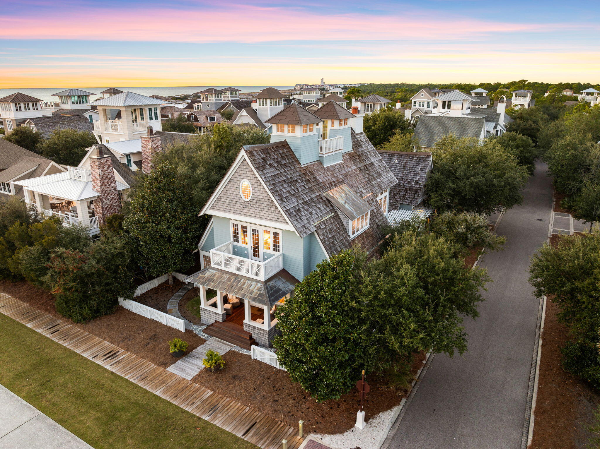 Nestled behind the private gates of WaterSound Beach in the Dune Ridge district, 73 S. Founders Lane encompasses over 3,700 square feet of meticulously planned living space spanning three distinct levels expertly curated by the acclaimed team at Dungan Nequette Architecture & Design.  The unique allure and exceptional craftsmanship exemplified throughout the residence are further evinced through the array of features in multiple publications including Portico, Southern Living and 30A Style. Upon initial approach the welcoming front porch leads way to the main living area perfectly configured for family gatherings with soaring beamed ceilings and seamless access to the screened in porch with day bed and rear courtyard area. The Chef's kitchen features custom Fuller Brothers cabinetry, an oversized island, professional appliance suite, and grand dining area anchored by a gas-burning fireplace. Also located on the first floor, the main suite encompasses sleeping quarters with dedicated porch access and a sumptuous ensuite with soaking tub, tiled wet room, dual vanities, ample wardrobe space, and a separate water closet. 

Three additional bedroom suites and a secondary living area complete the second level. Creating an additional layer of accommodation, the self-sufficient coach house above the garage boasts a kitchenette, laundry area, sleeping quarters, and an en-suite.

Currently unfinished and utilized for storage, the third-floor conditioned attic space is a blank canvas that conveys coupled with preliminary building plans to create an additional main suite with stunning Gulf views. Perched atop the roof line, the viewing tower is the perfect place to embrace the coastal breeze, panoramic views out to sea, and admire the renowned Emerald Coast sunsets providing a new palate of mesmerizing hues each and every night.

Bordered by park frontage with direct access to the Dunesider resort-style pool and WaterSound's unique interconnected boardwalk system leading the way to the turquoise hued water in addition to an array of parks and green space, the prime corner homesite is ideally positioned while simultaneously upholding a heightened sense of privacy and courtyard footprint that could accommodate a private swimming pool if desired. 

Watersound Beach resides on 1,400 acres and over a mile of private white sugar sand beaches. The culmination of amenities and exclusiveness affords residents with the epitome of private coastal living while remaining geographically poised near the world-class dining and entertainment venues 30A has to offer. 73 S. Founders Lane is a rare and special residence to be cherished by discerning owners for years to come- inquire today to schedule a private viewing.
